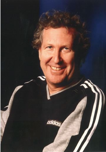 Man wearing adidas sweatshirt smiling at camera, Robert, Louis-Dreyfus, CEO, adidas, history