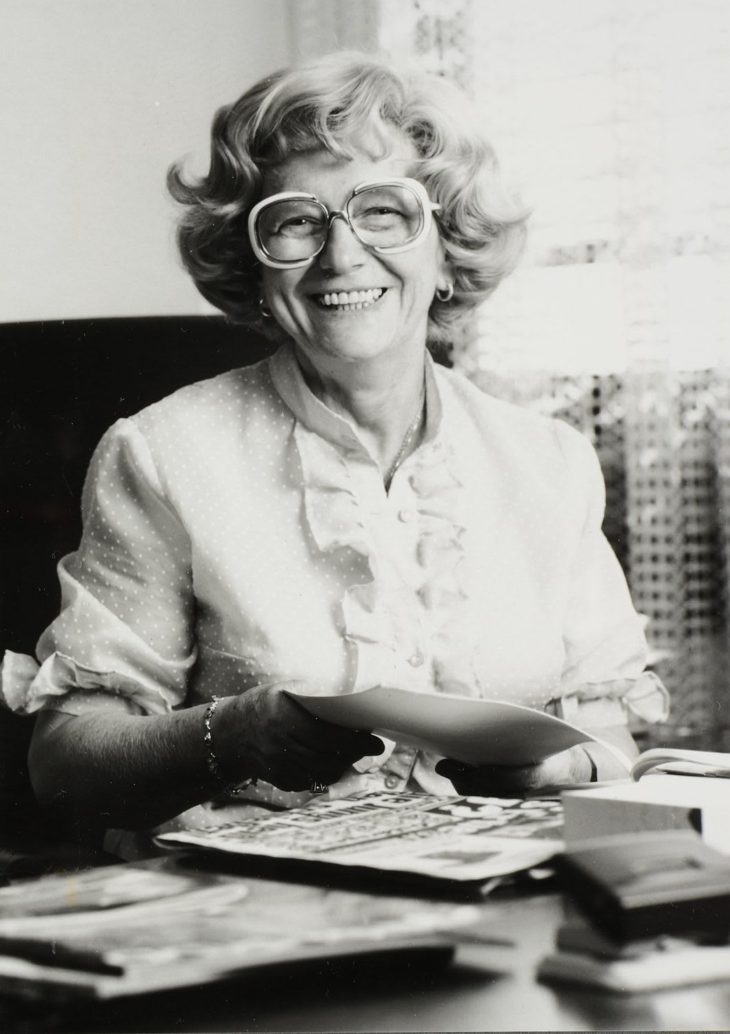 Black-and-white picture of woman in glasses smiling at the camera, Kathe, Dassler, adidas, sports, history