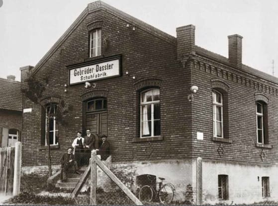 Black-and-white image of old brick building, adidas, factory, Herzogenaurach