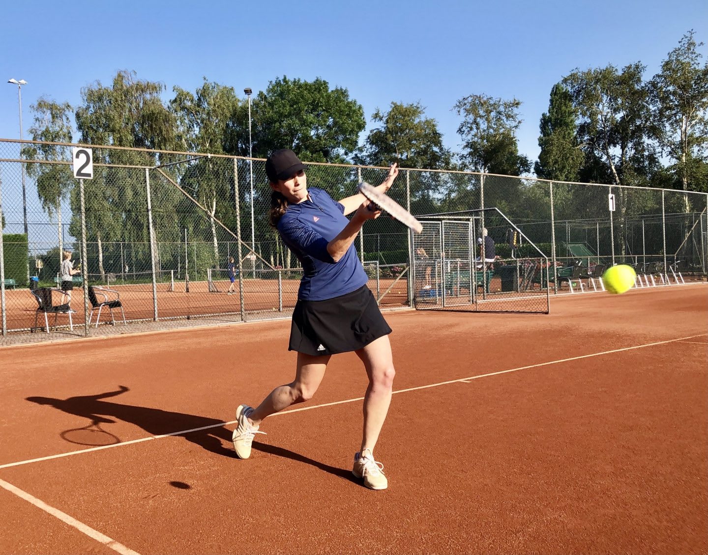 Woman hitting a tennis ball on a tennis court, sport, sports, adidas, employee, Samantha Jacobs