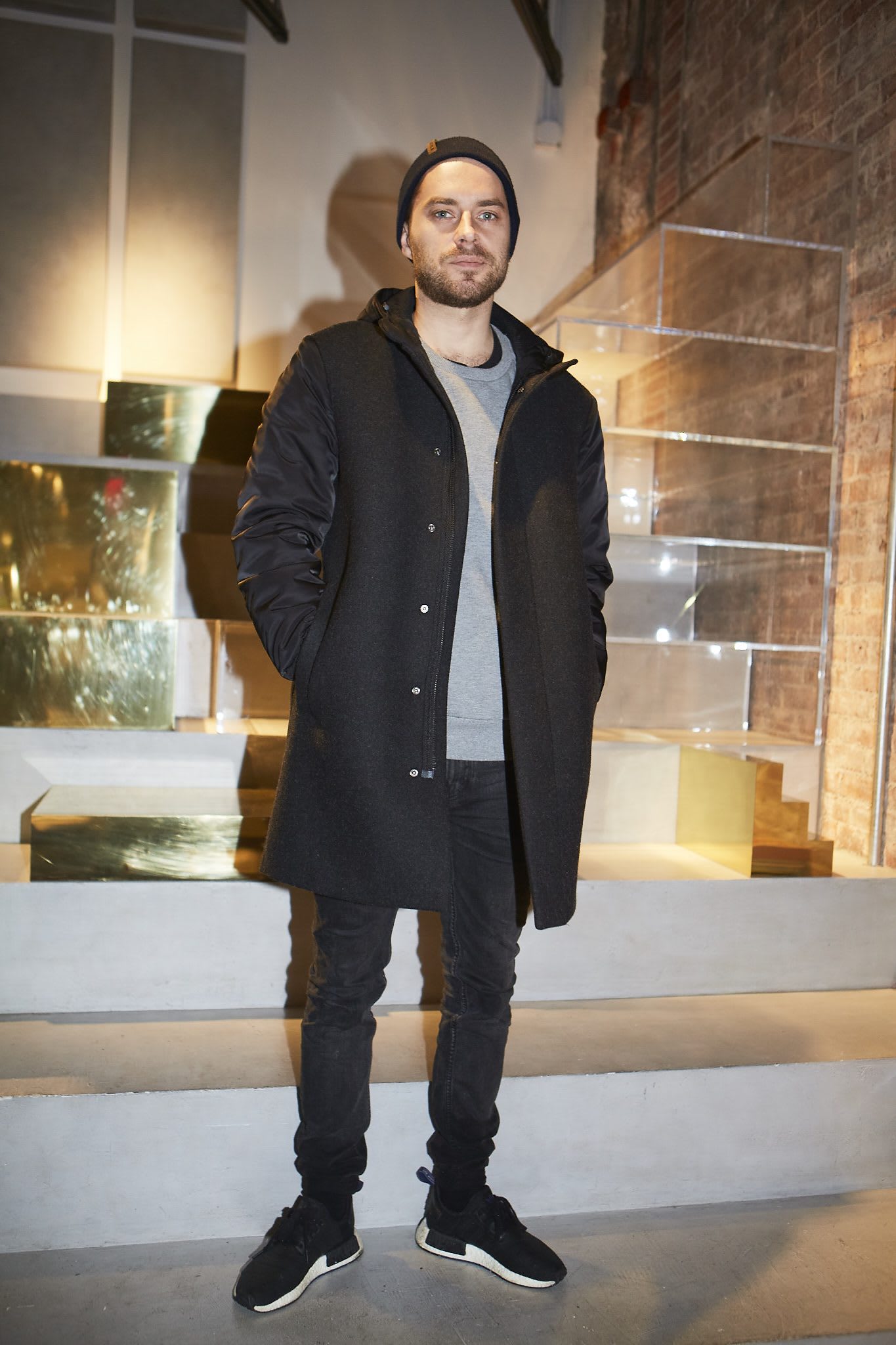 man with cap and black jacket creators in NYC