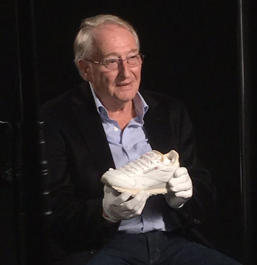 Joe Foster, Reebok co-founder holding Reebok sneaker Classic Leather