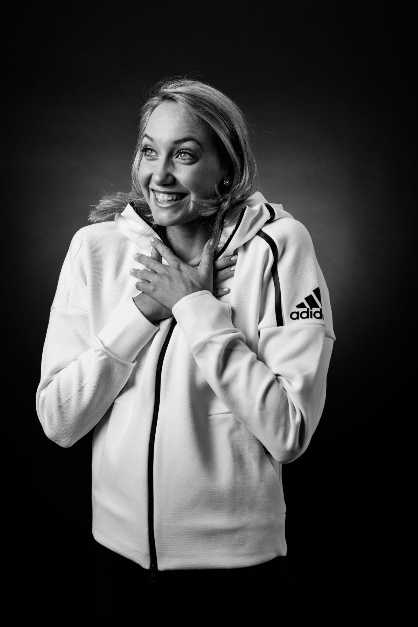woman in white hoodie happy smiling aussie swimmer madison wilson talks voluntary work time management handling pressure