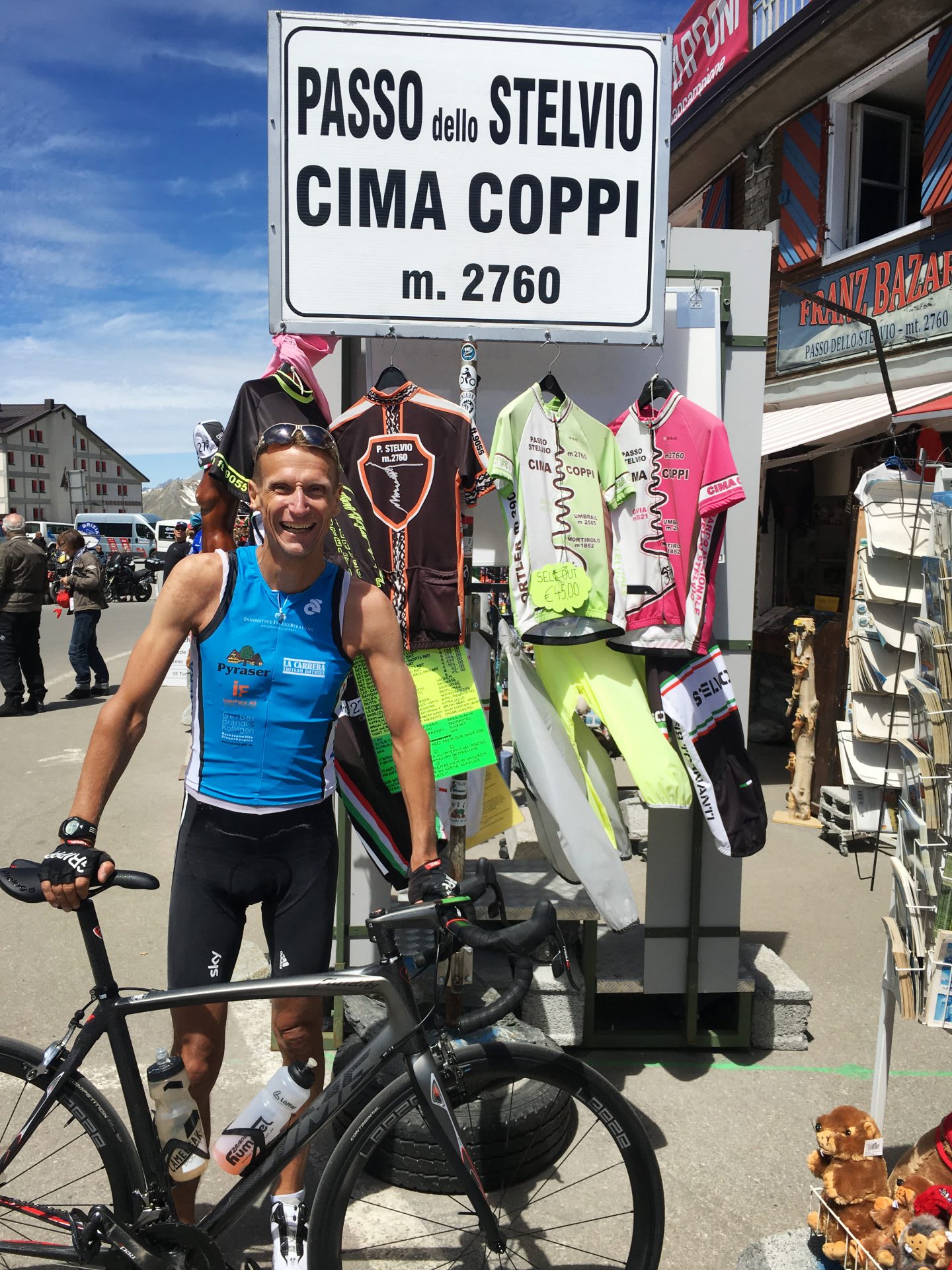 man with bicycle in front of road sign active holidays best way to unwind