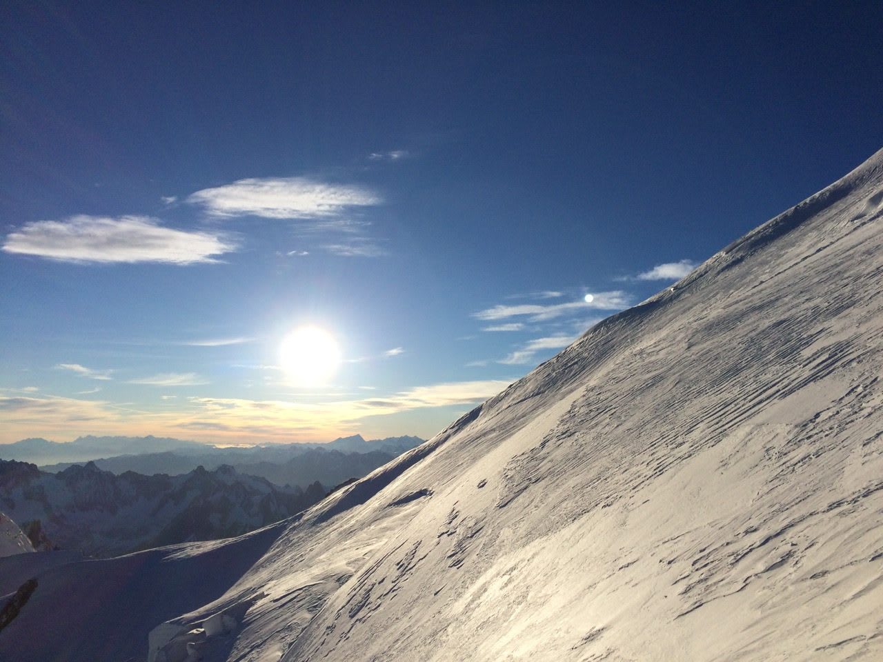 Part of a snowy mountain and the sun in the background, Mont Blanc_Snowy Mountain_Mountaineering_Landscape, adidas, GamePlan A, Marcus Leach, Risk Taking