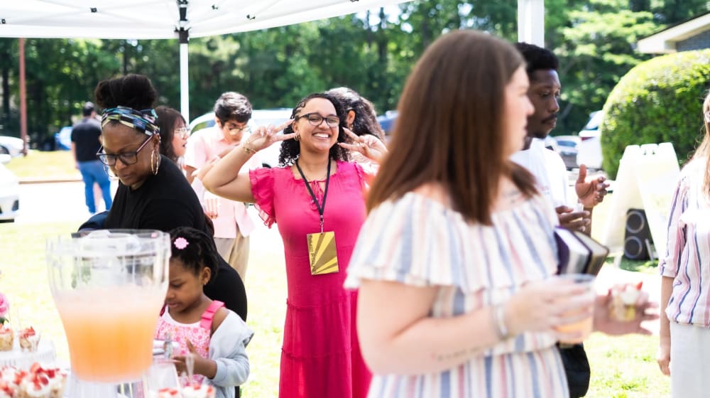 An outdoor summer garden party under a white tent