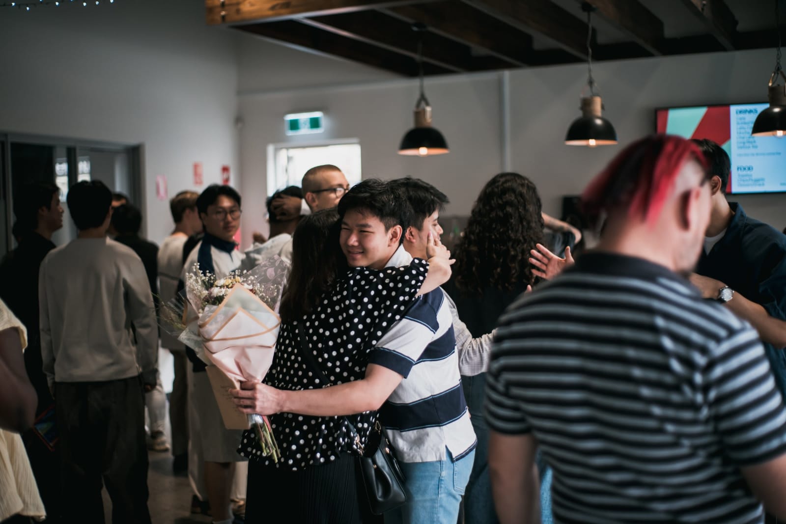 Asian Boy and Woman Hug Foyer Sunday