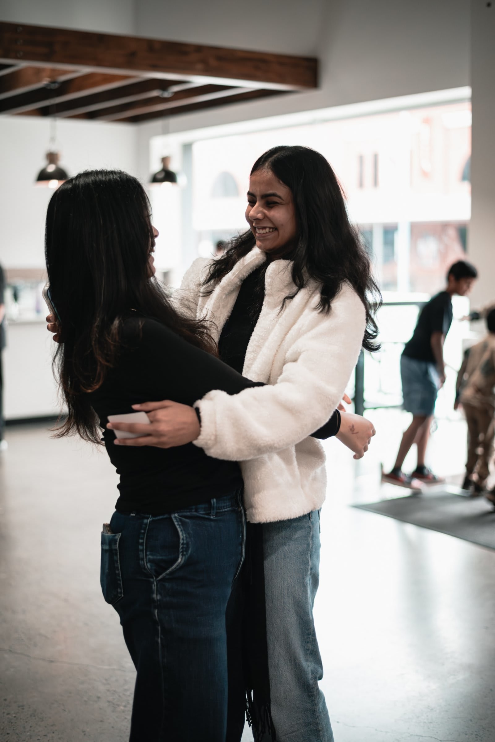 City Two Women Hug