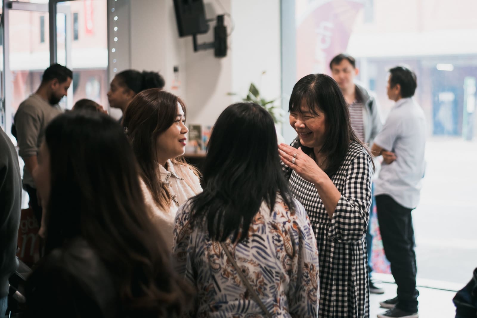 Members of the Futures Church community chatting and laughing together