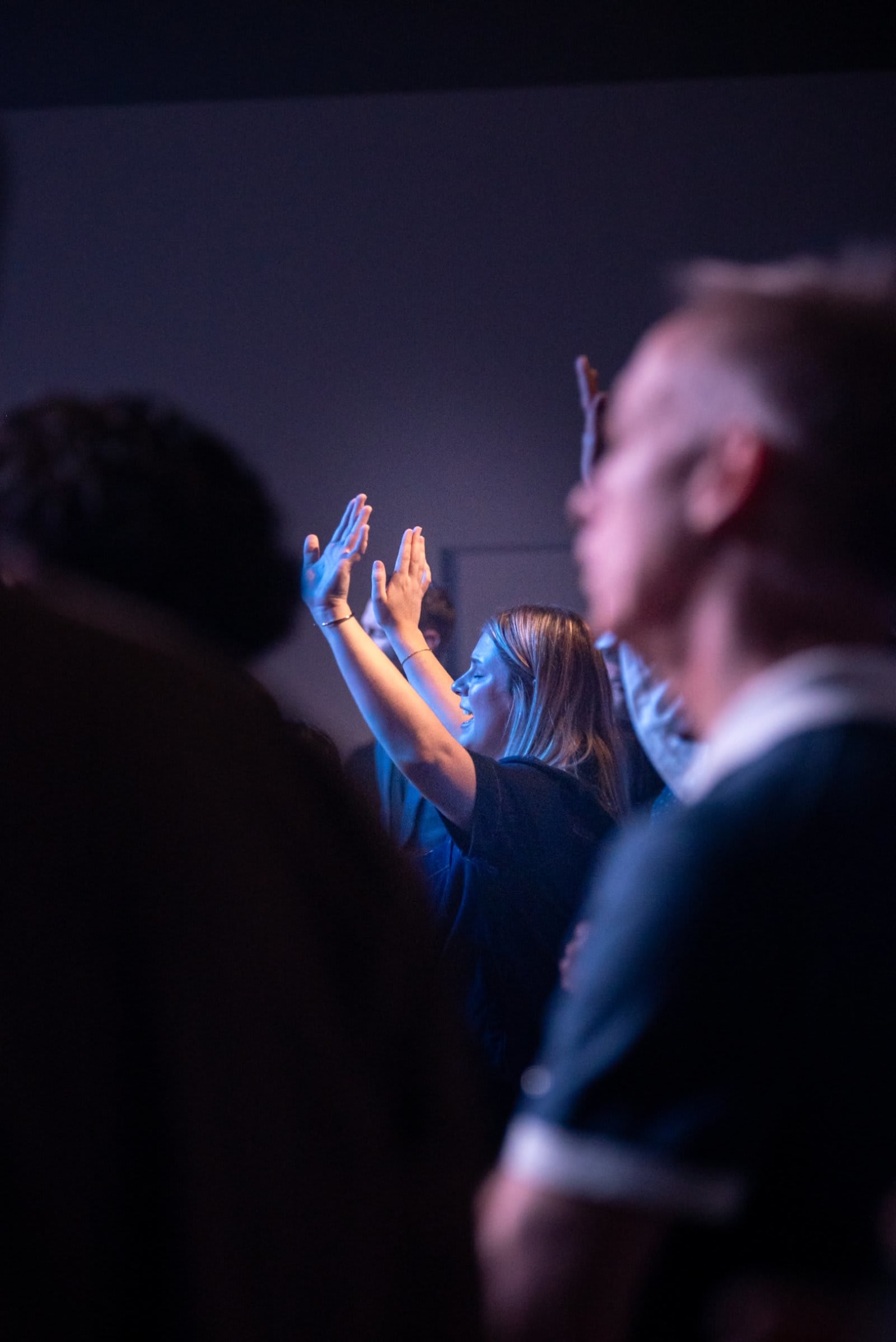 White Women Praising with Hands Lifted