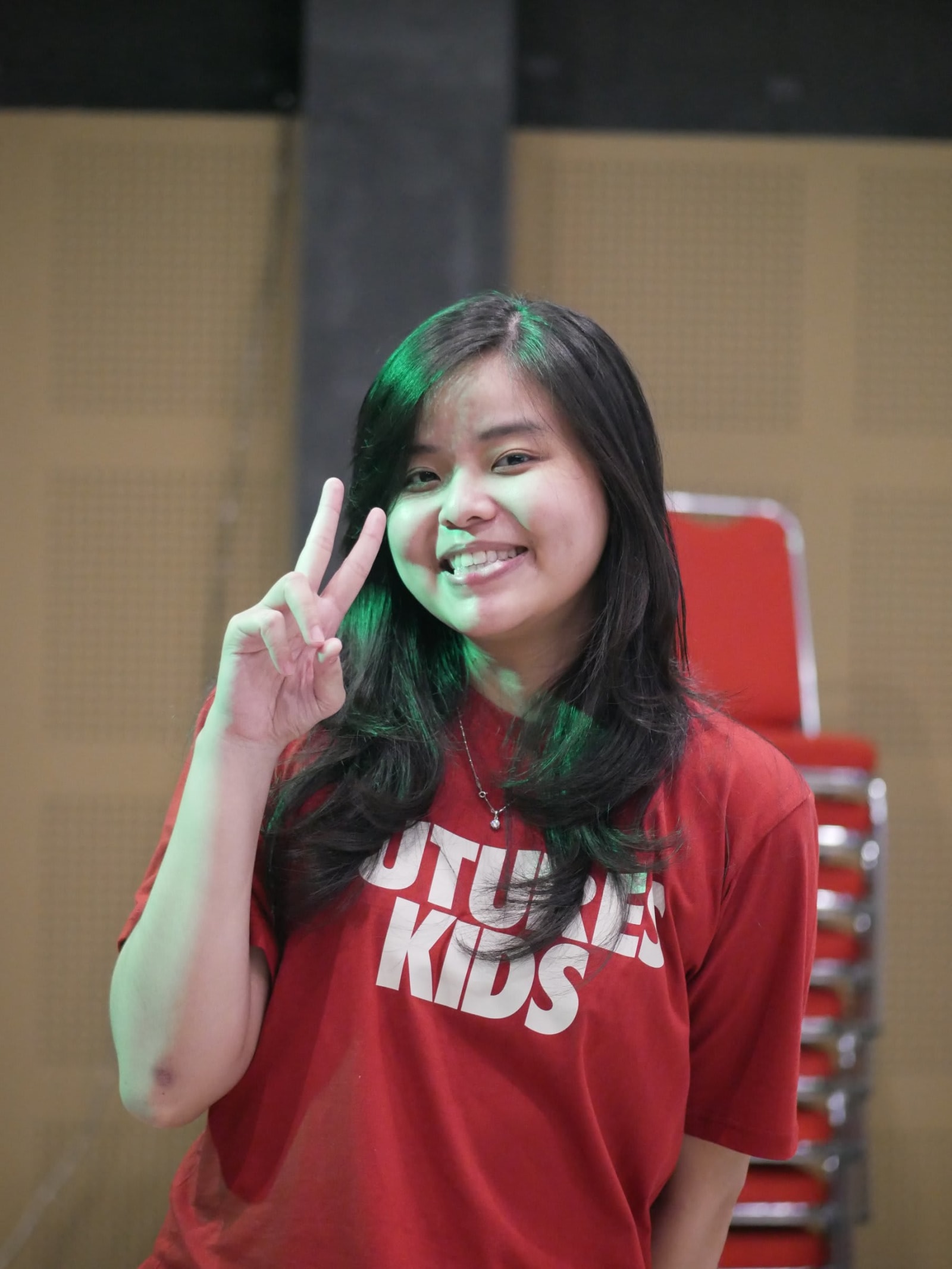 Bali woman peace sign smiling