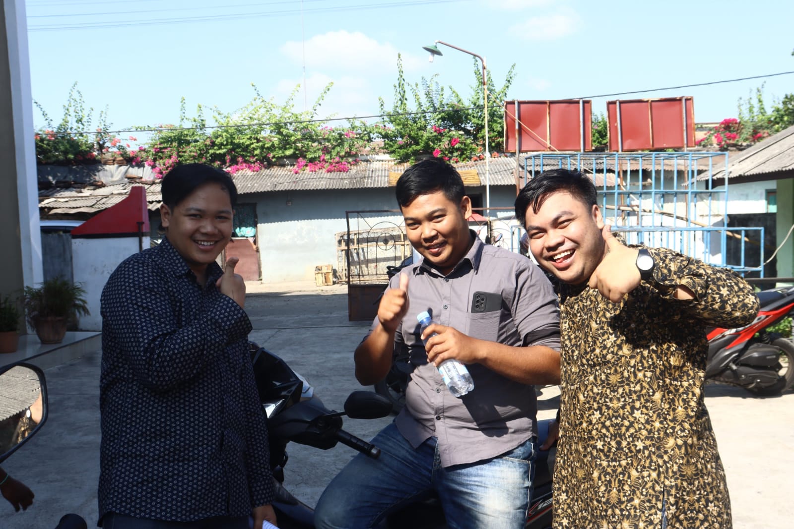 cemani young men outside church smiling