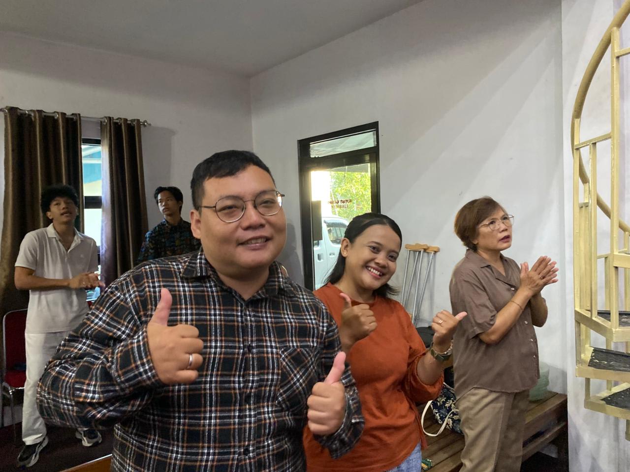 cemani adults in praise and worship thumbs up smiling