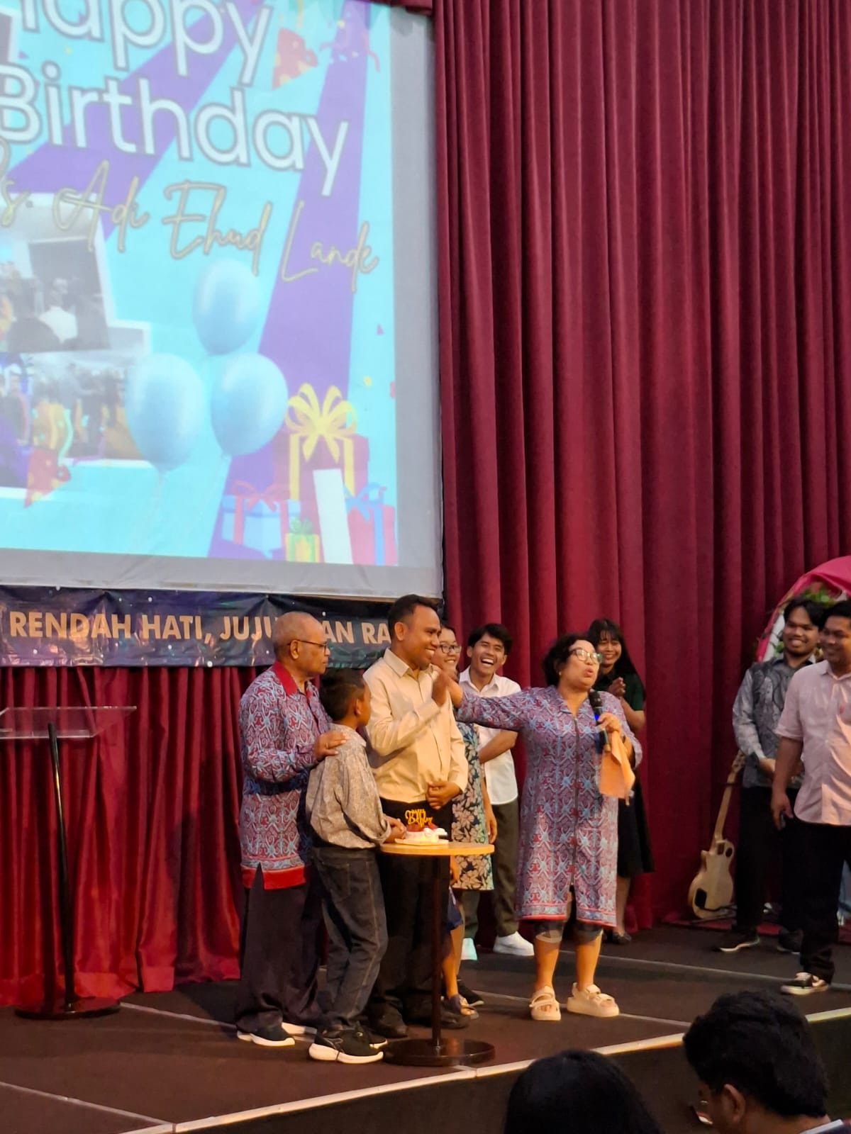 cemani campus pastors adi and lala being prayed for on stage