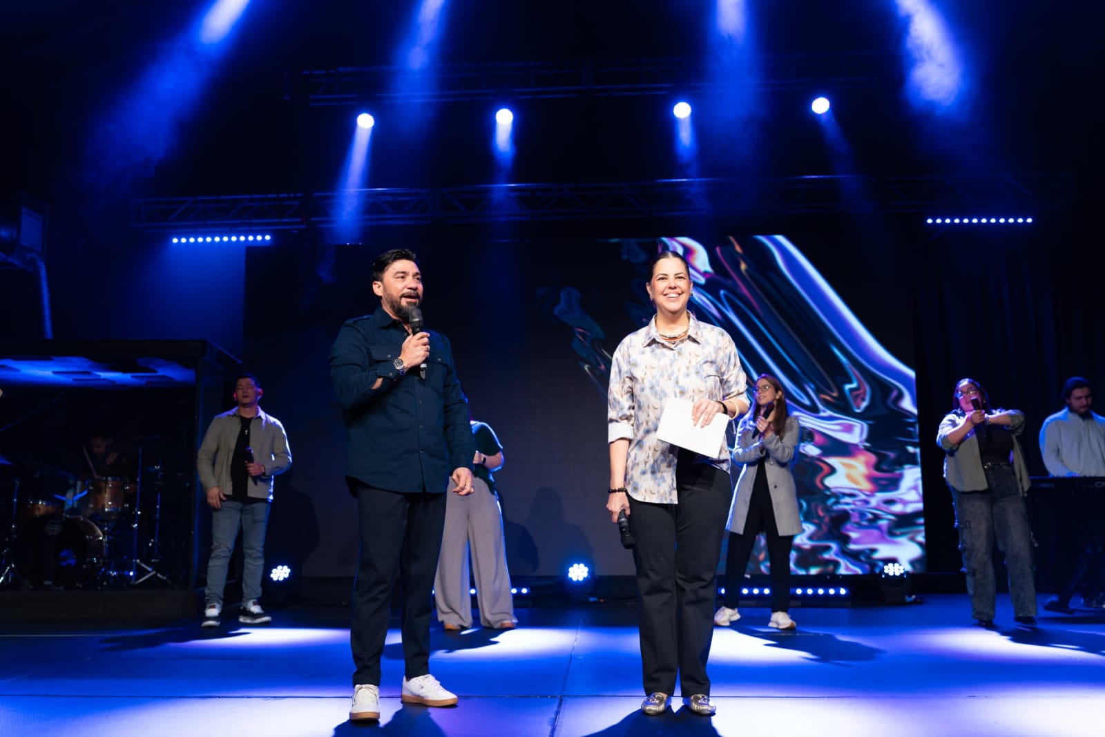 Two hosts speaking on stage / duluth