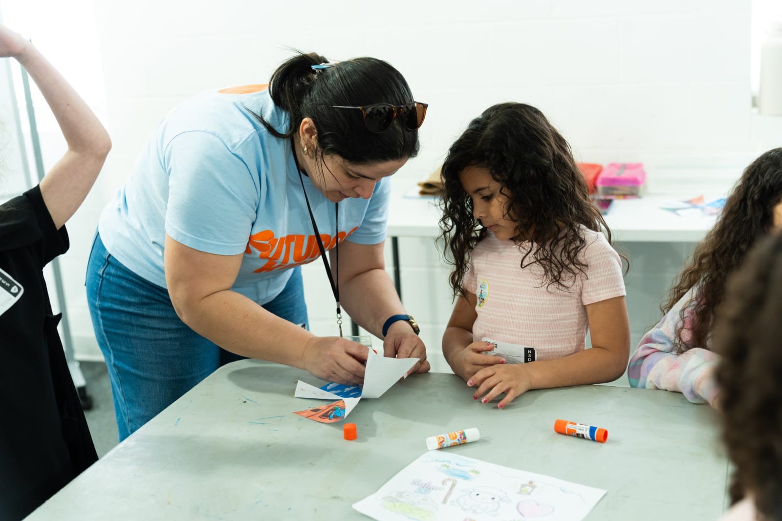 A woman helping a child with crafts / duluth