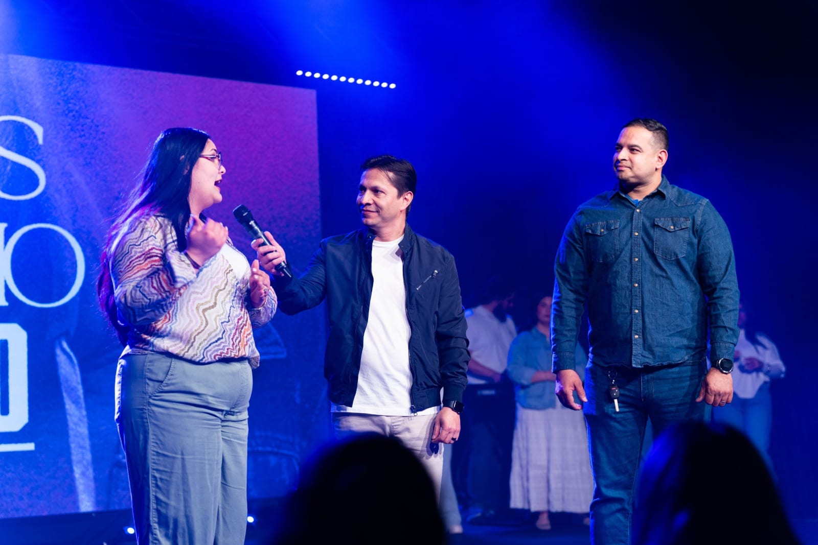 A woman speaking on stage with others / duluth