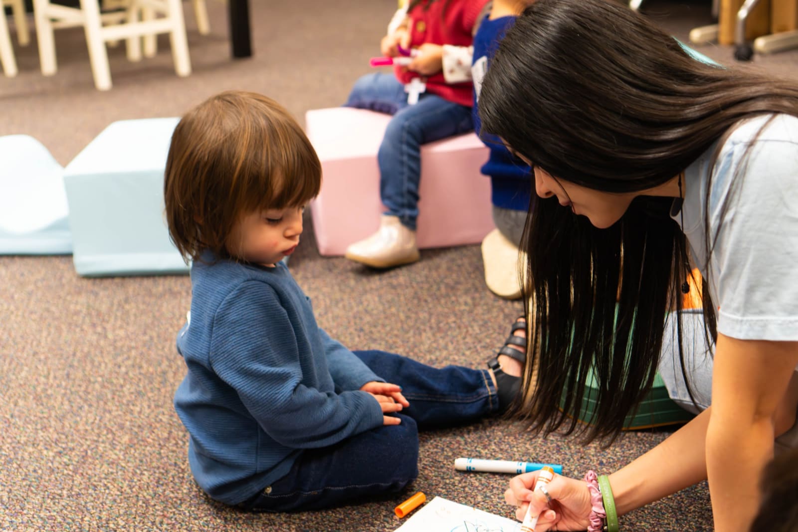 Leader coloring with a toddler on the floor / grayson
