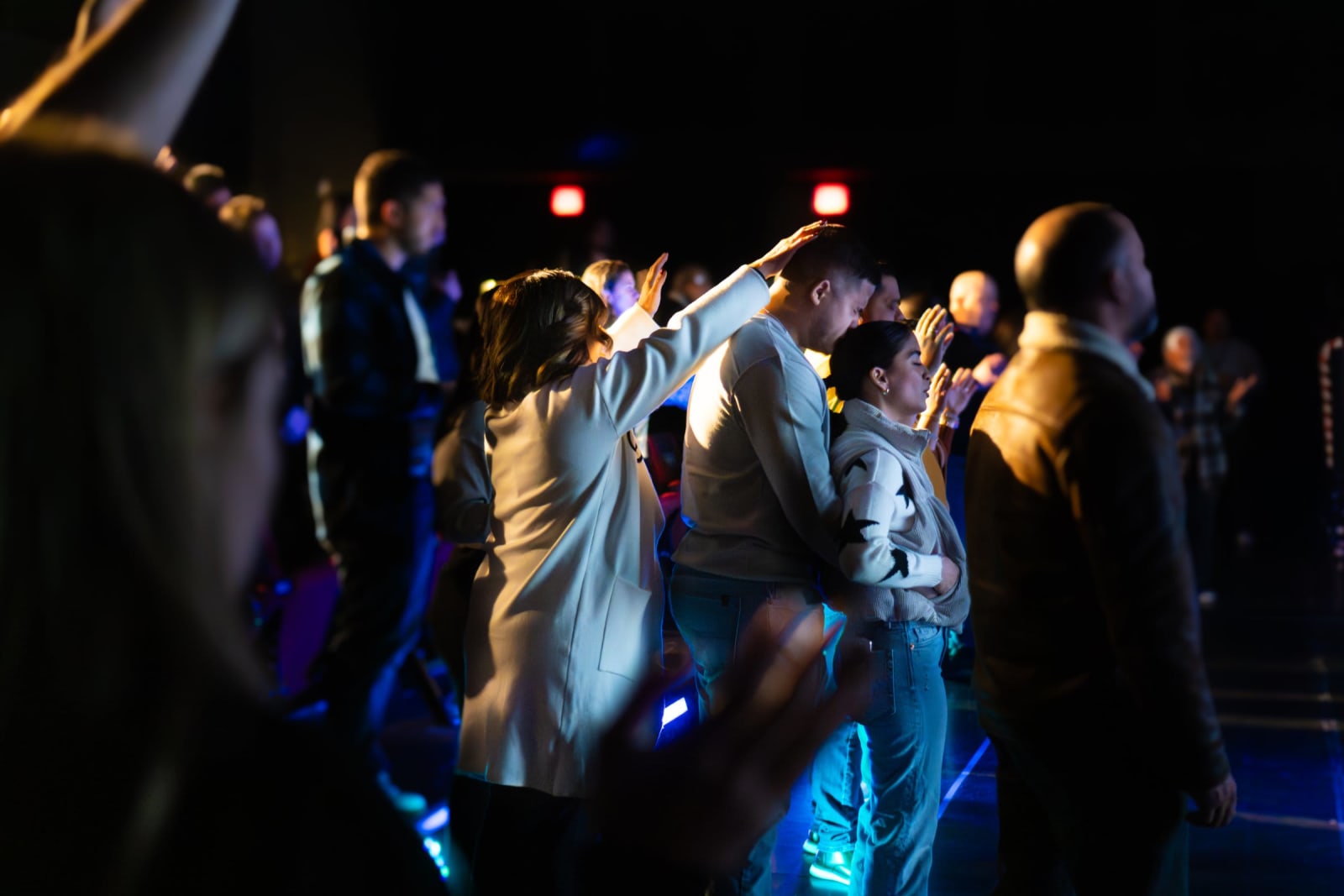 People worshipping during a church service / grayson