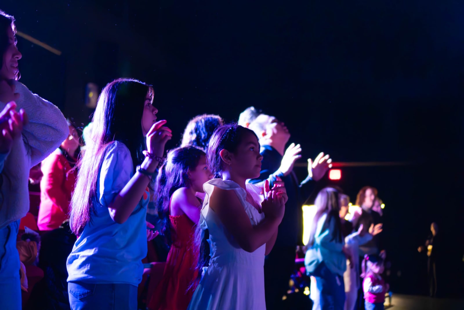 Children worshipping with raised hands / grayson