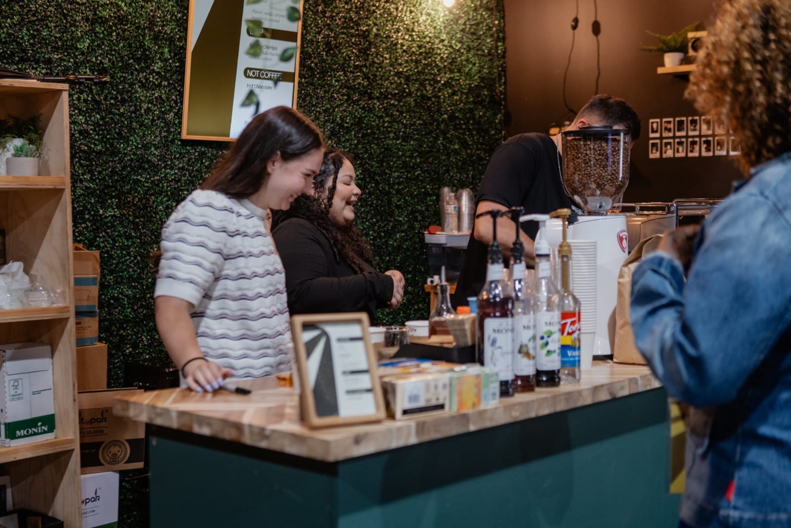 people being served drinks at the cafe counter / gwinnett