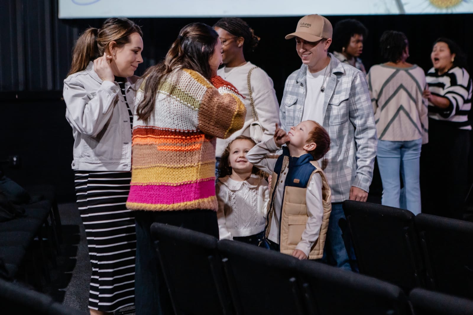 kids smiling with friends and family / gwinnett / auditorium