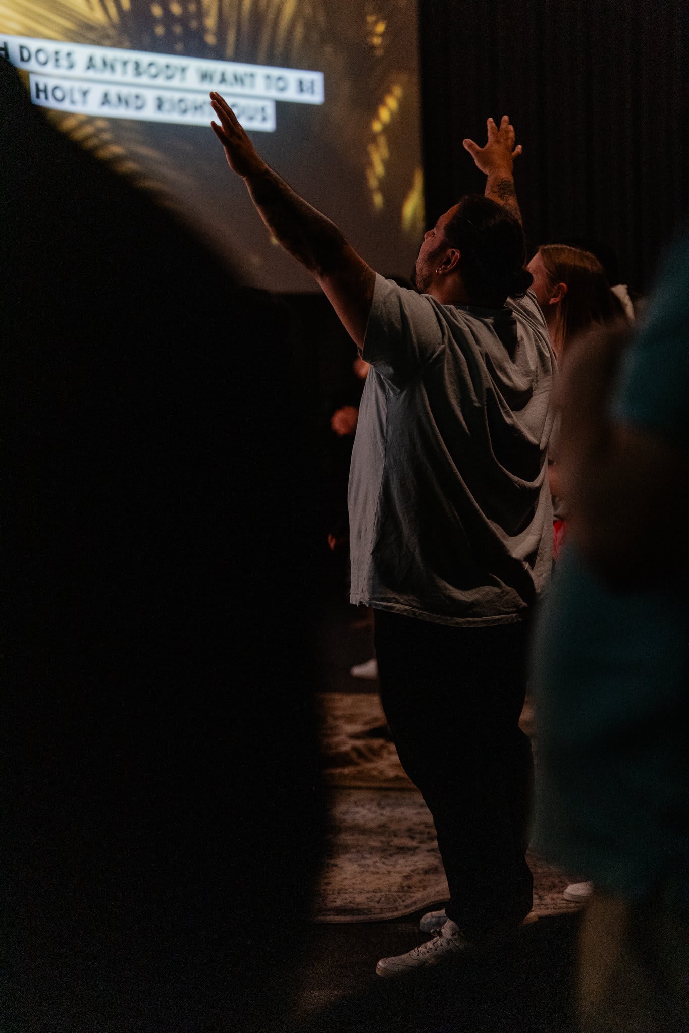 Man worshipping with hands raised  / Gwinnett