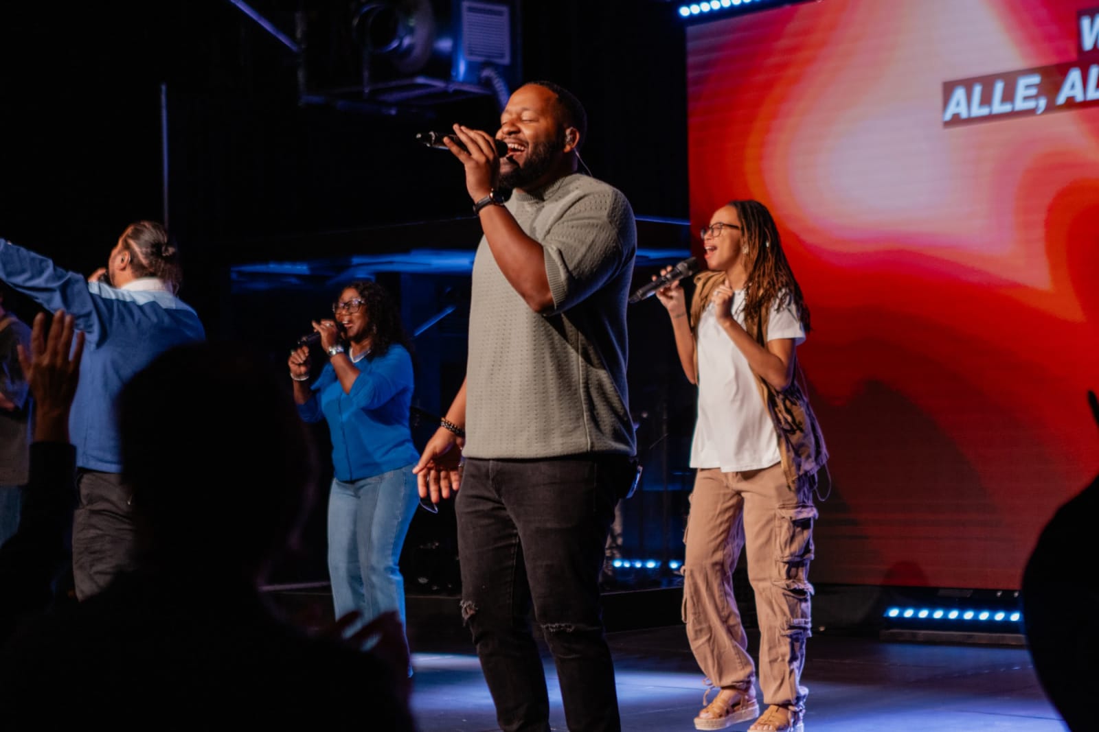 Man Singing with Worship Band  / Gwinnett + Stage