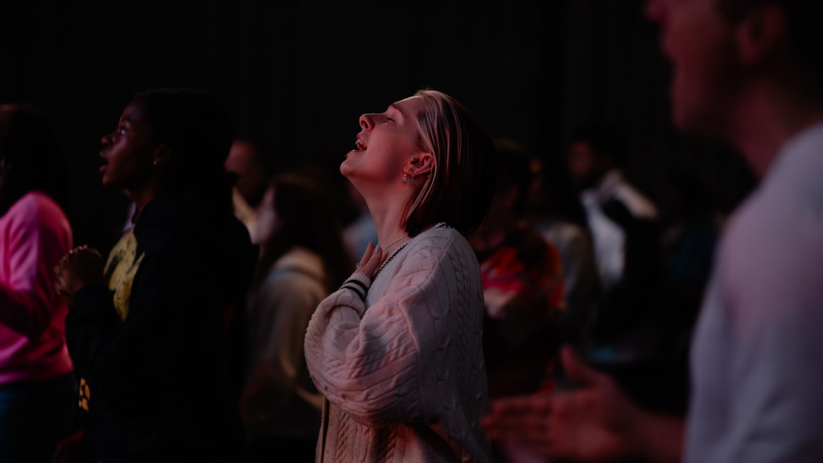 woman singing in worship / gwinnett