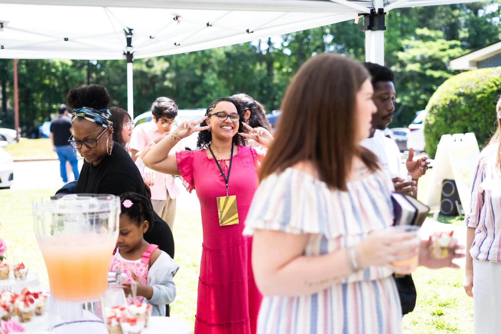 people mingling at outdoor church event / kennesaw