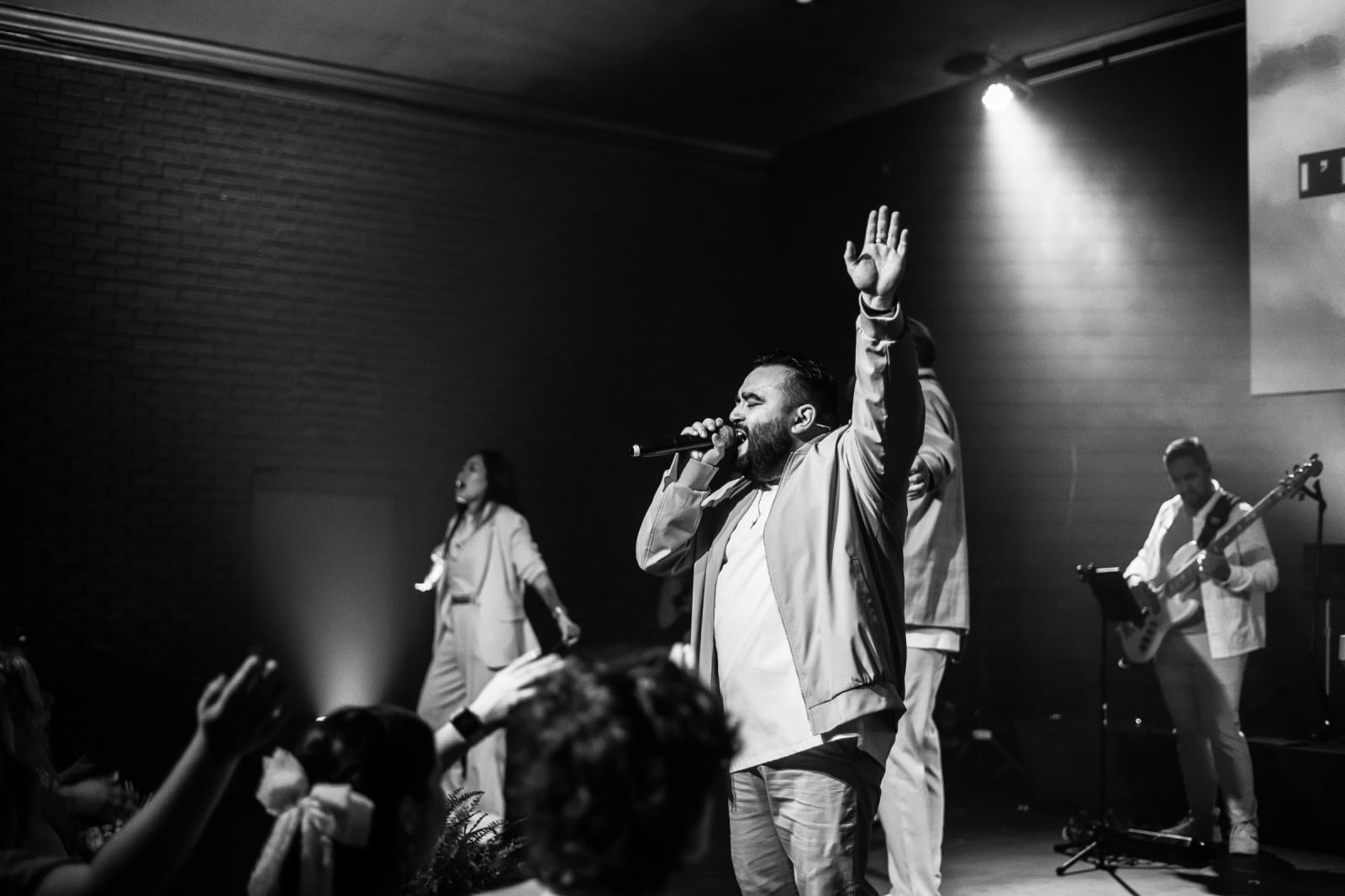male worship singer with hand raised black and white photo / kennesaw