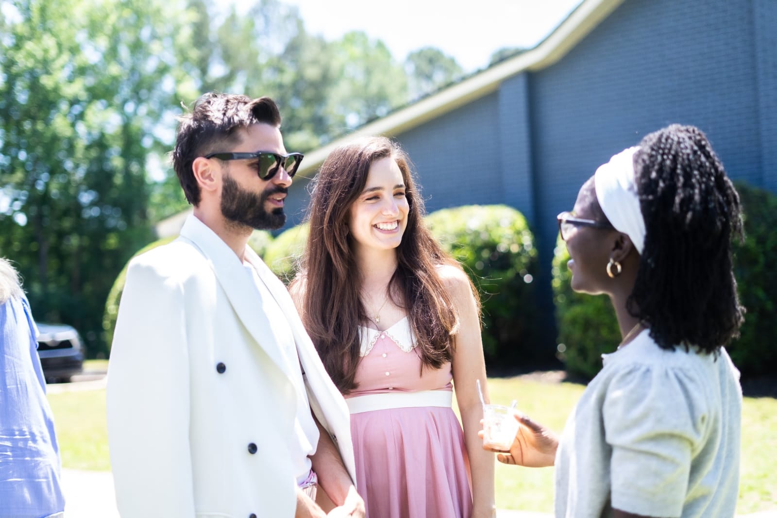 three young adults talking outdoors / kennesaw