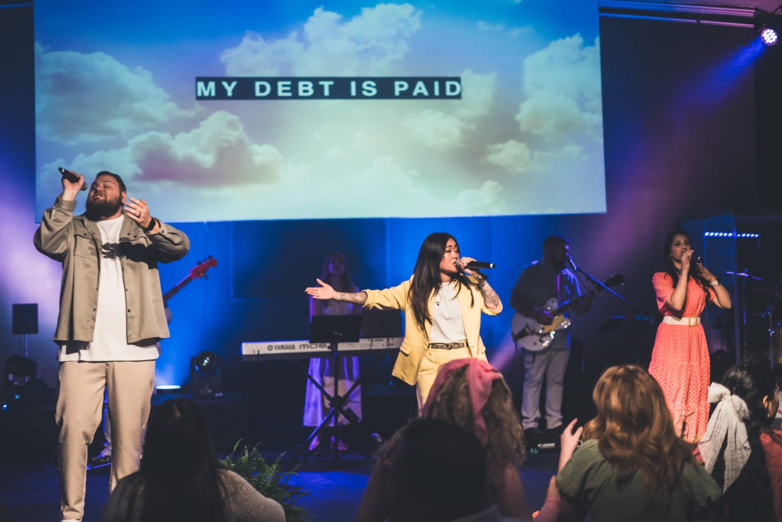 worship singers on stage with congregation / kennesaw