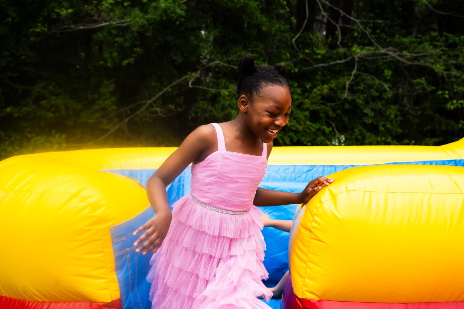 young girl playing on bounce house / kennesaw