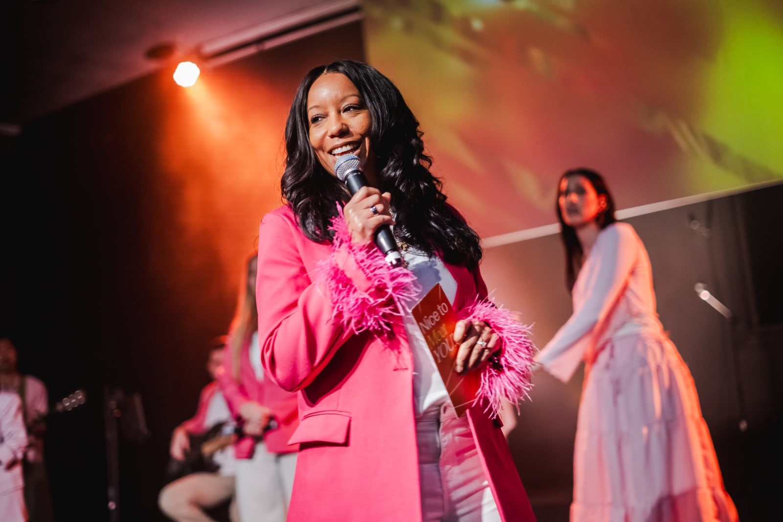 woman speaking on stage with microphone / kennesaw