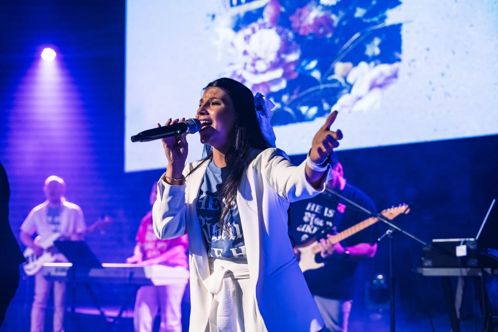 female worship singer performing on stage / kennesaw