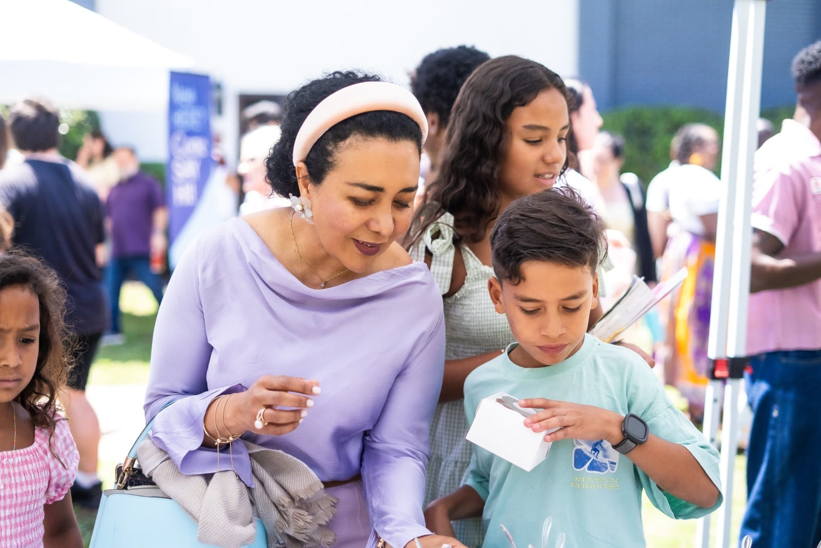 woman with children at outdoor event / kennesaw