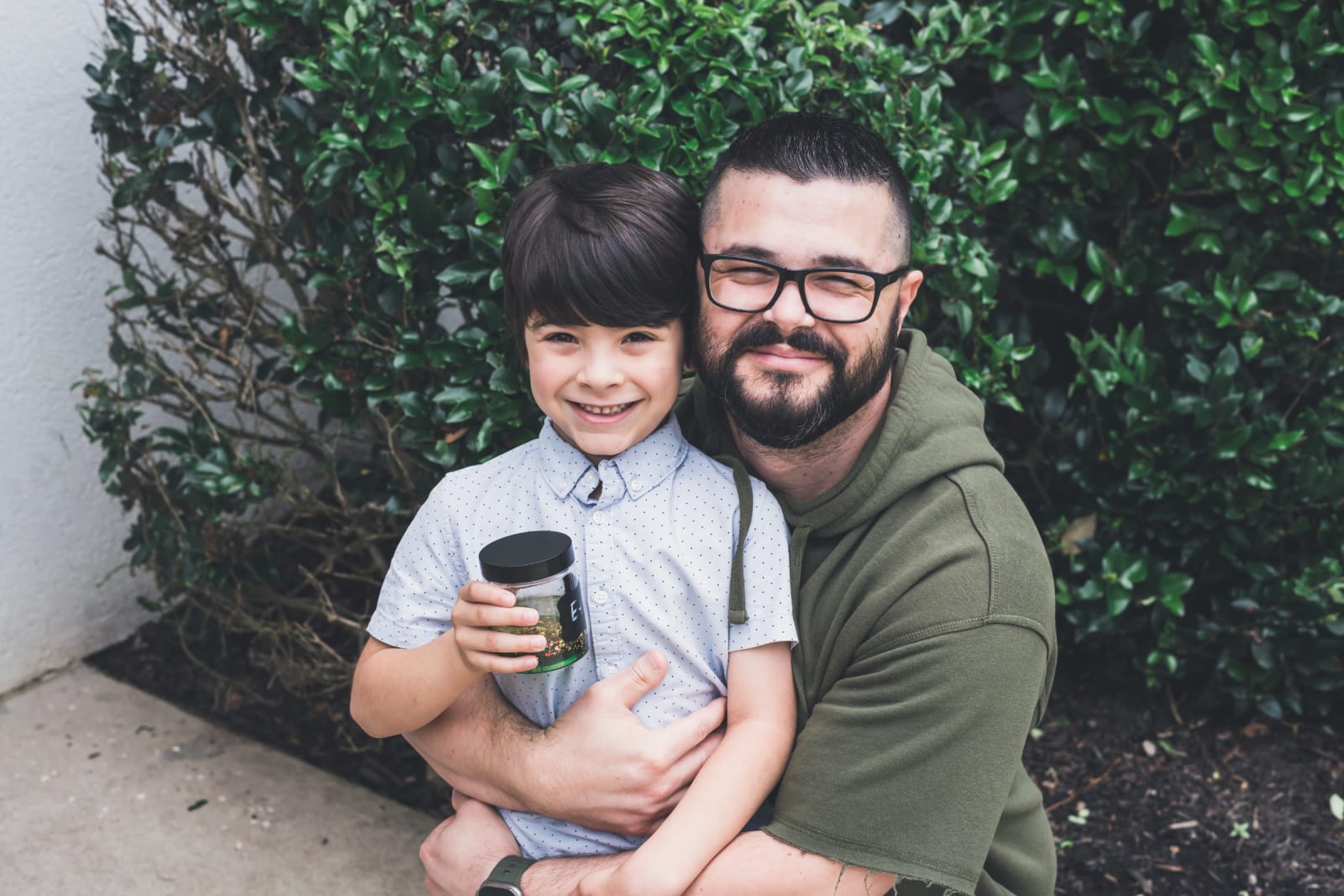 man holding smiling young boy / kennesaw