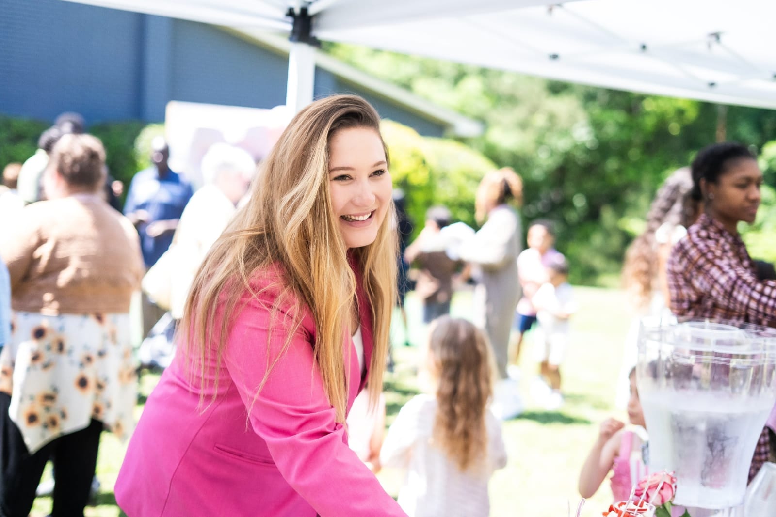 young woman smiling receiving something