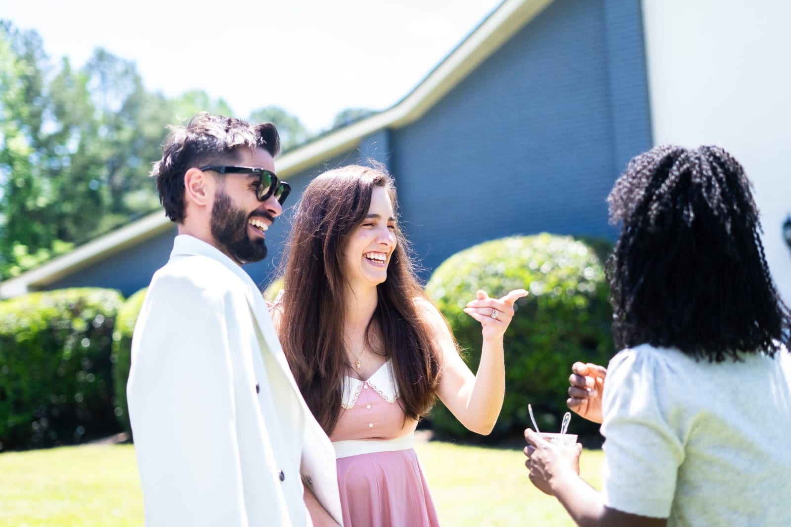 people chatting outdoors with drinks / kennesaw