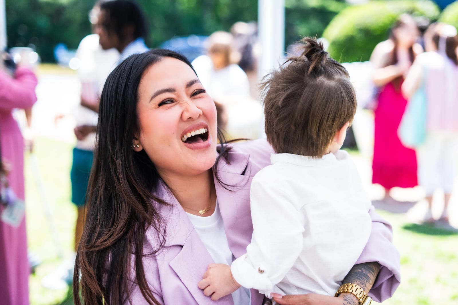 kennesaw woman holding child smiling
