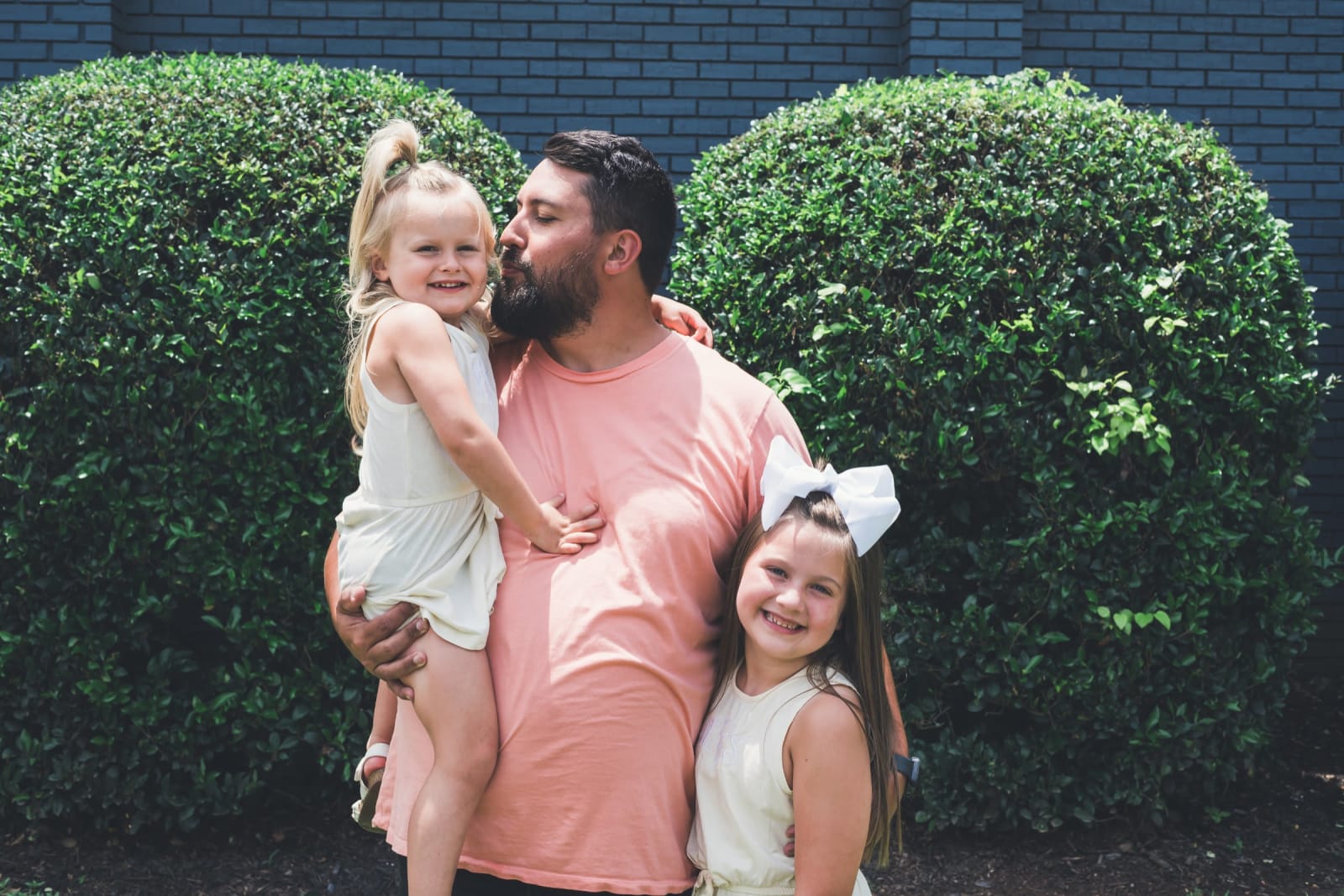 father with two young daughters outdoors / kennesaw