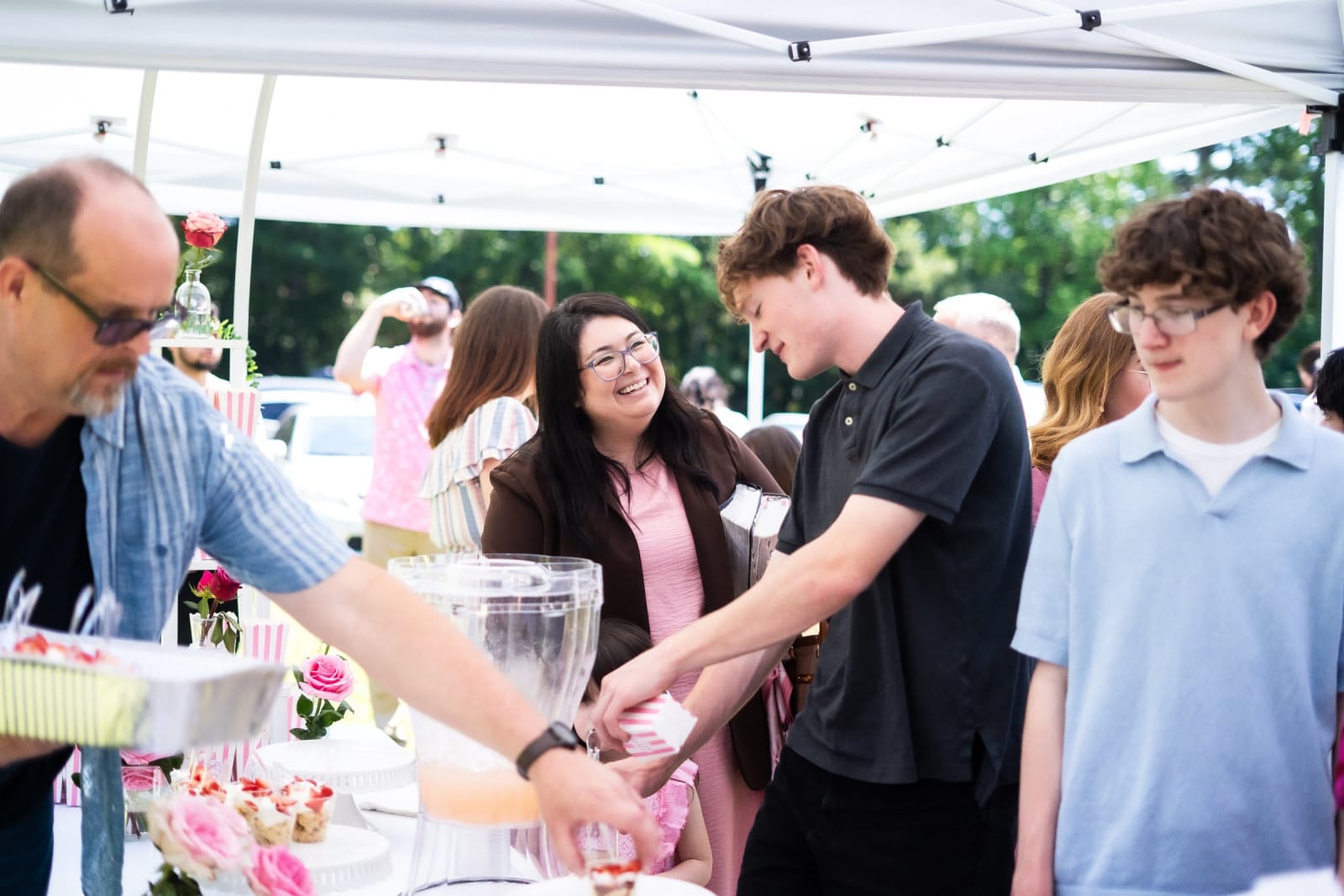 people at outdoor dessert table / kennesaw