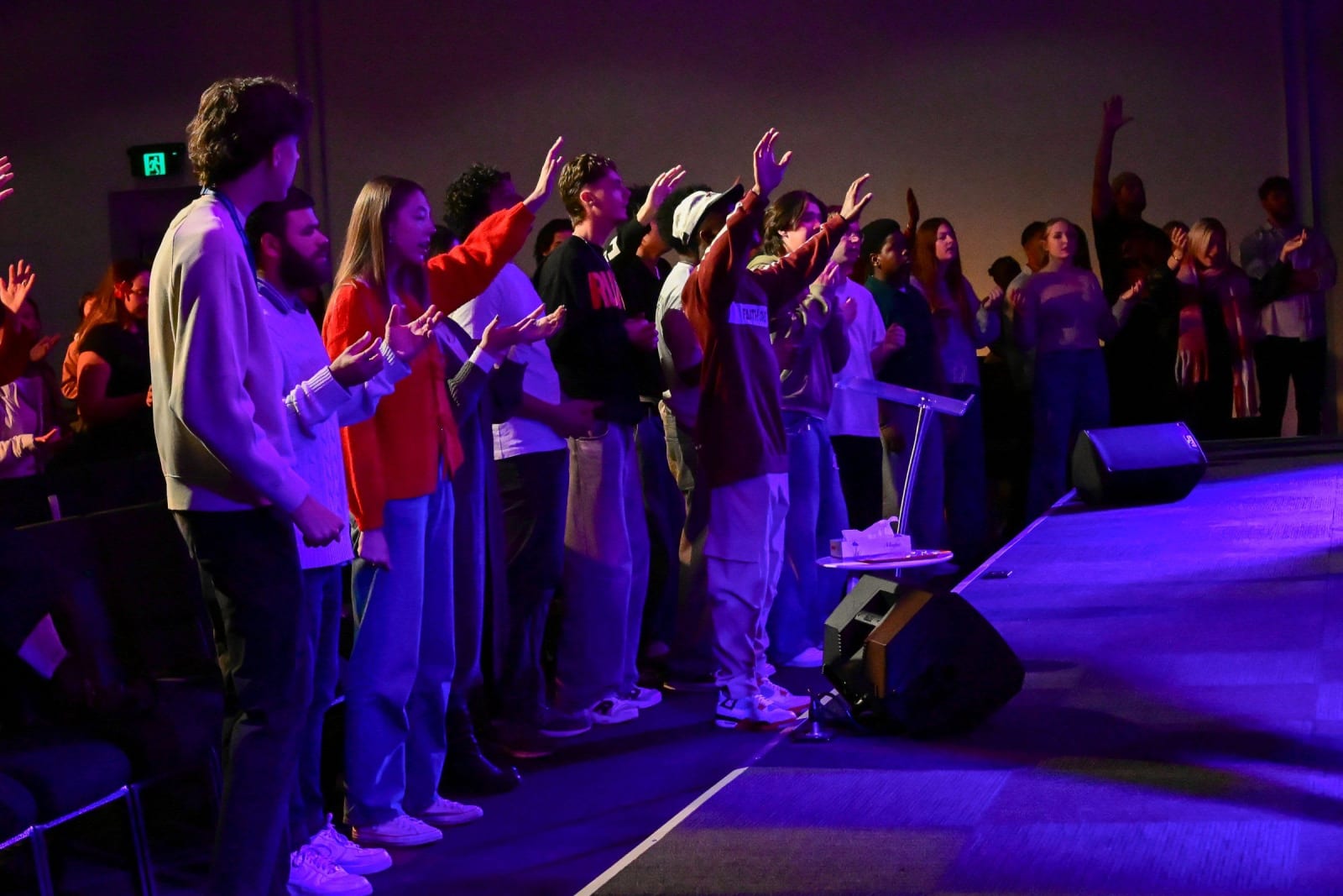 Crowd worshipping with raised hands / salisbury