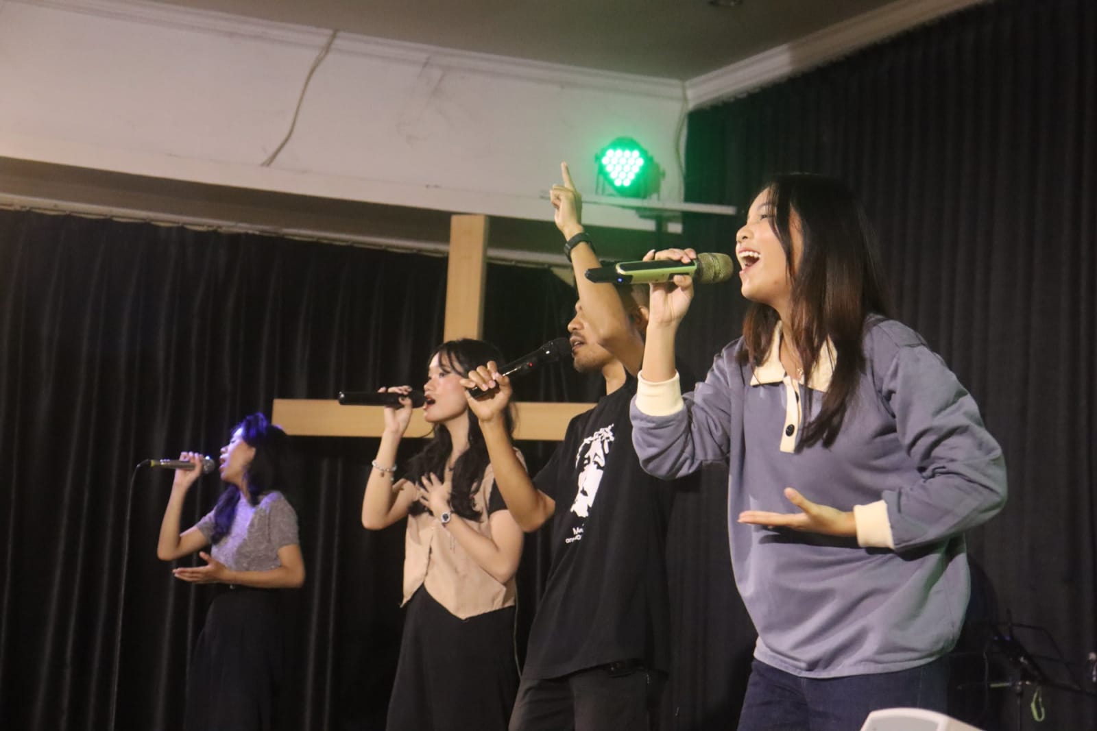 Worship singers on stage at Solo campus church Sunday morning service
