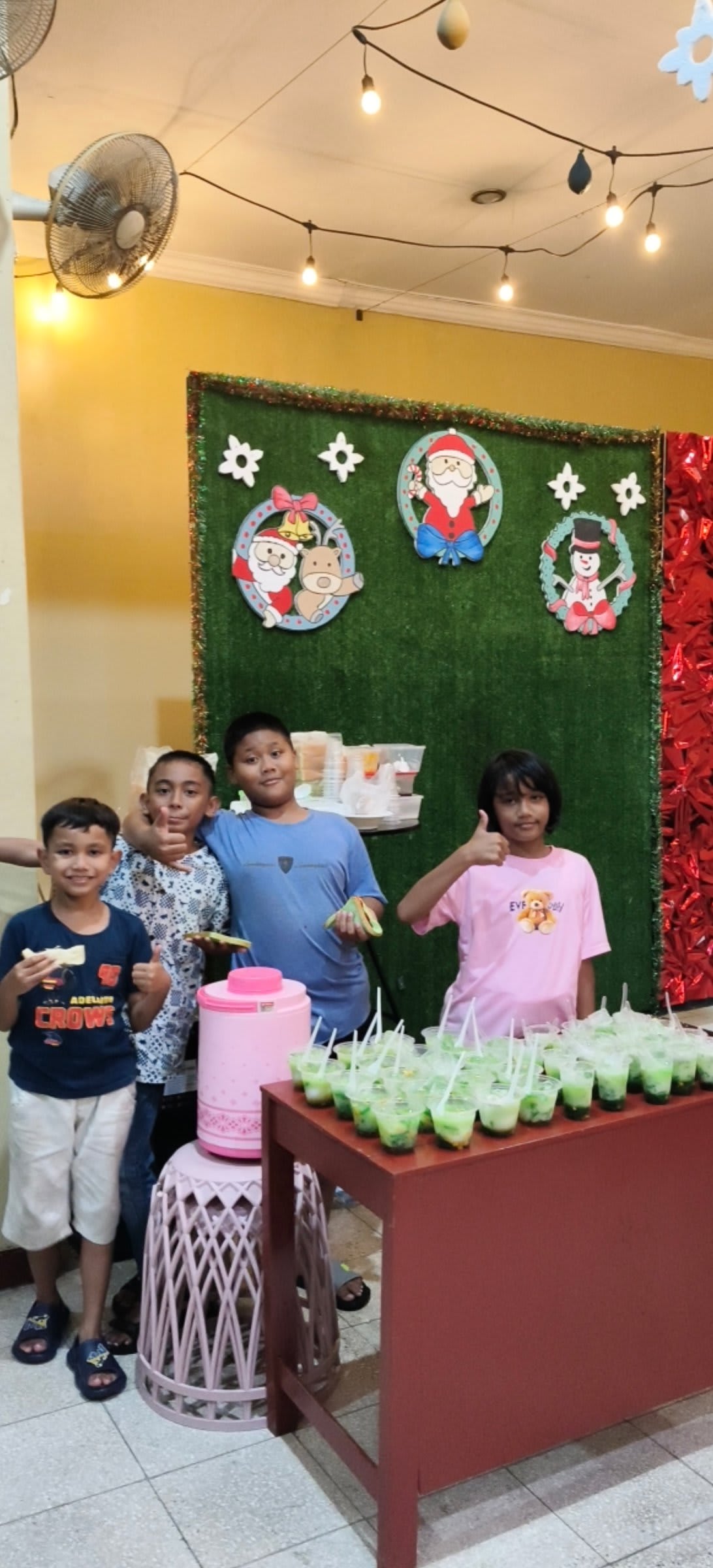 Kids posing at Christmas photo booth at Solo campus Futures Church holiday event