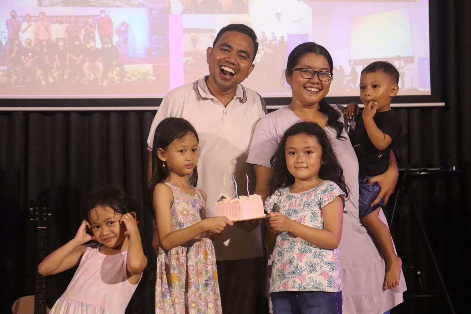Pastor family with children on stage at Solo campus Futures Church service