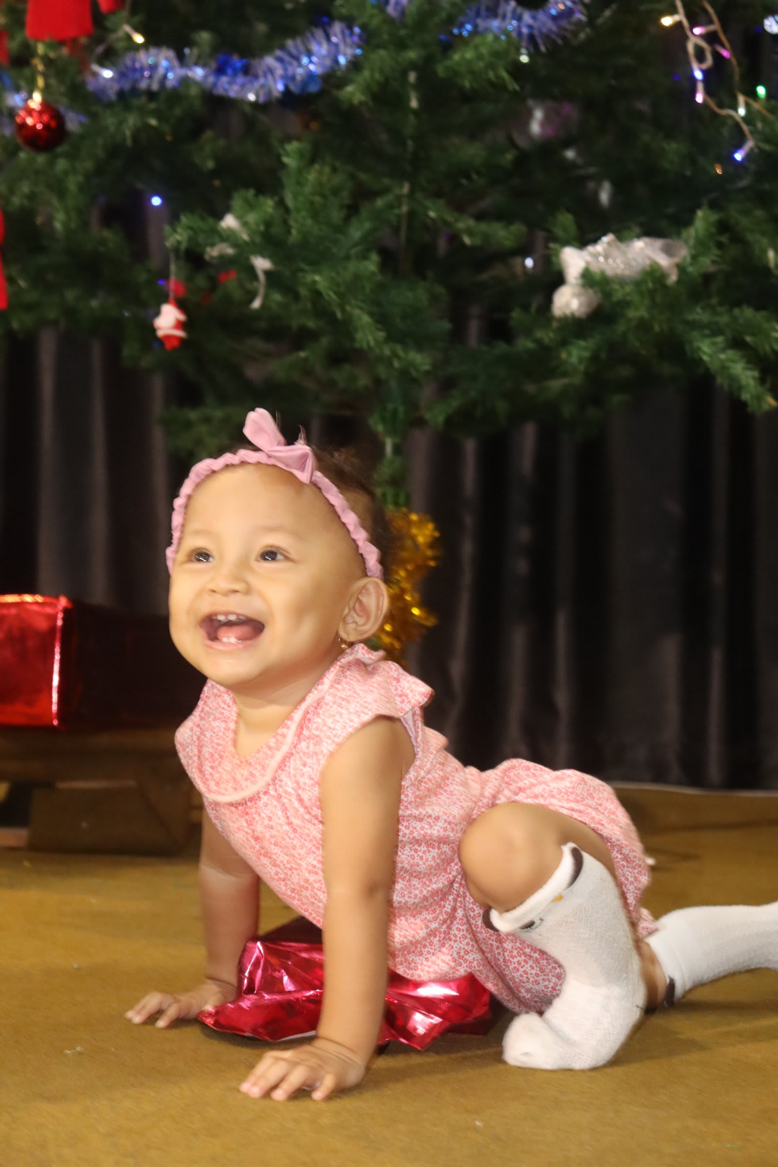 Smiling baby girl at Solo campus kids church holiday celebration
