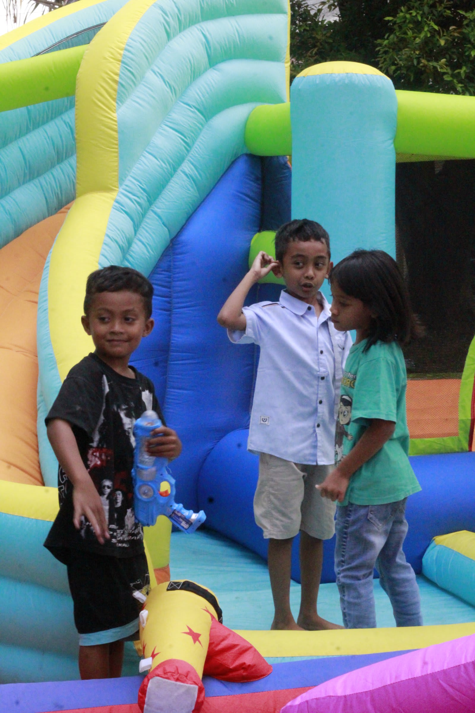 Kids playing at bounce castle at Solo campus Futures Church kids event