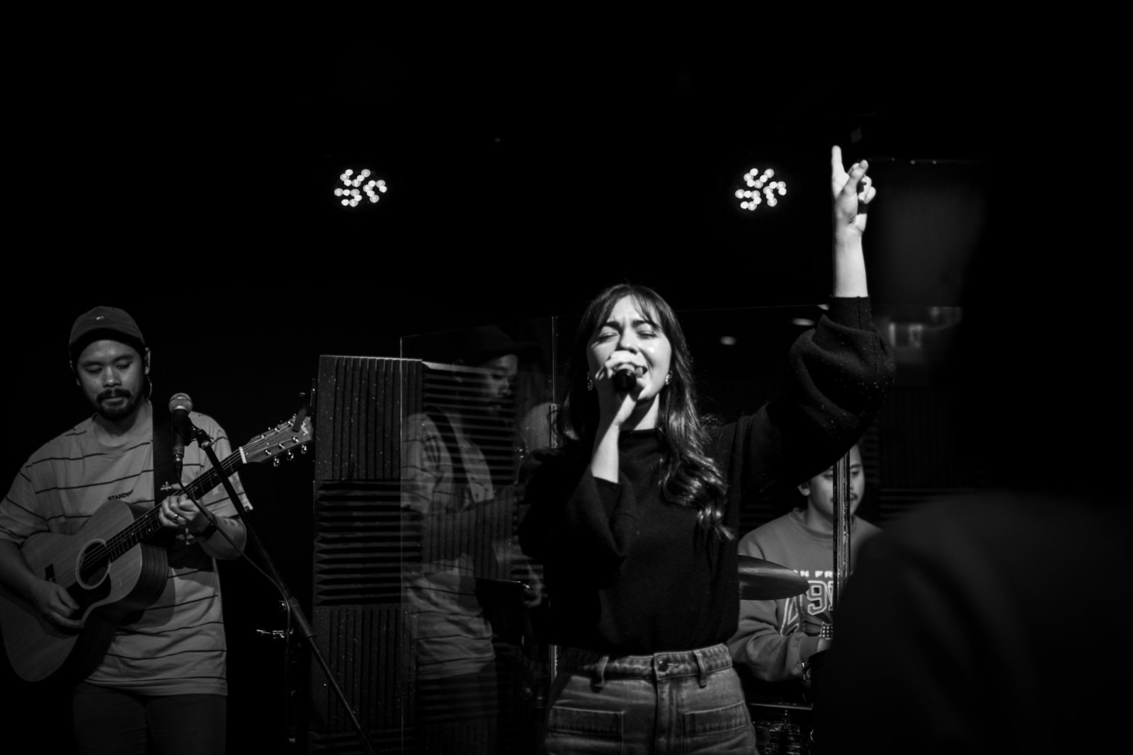 A worship band leading singing on stage / victor harbor